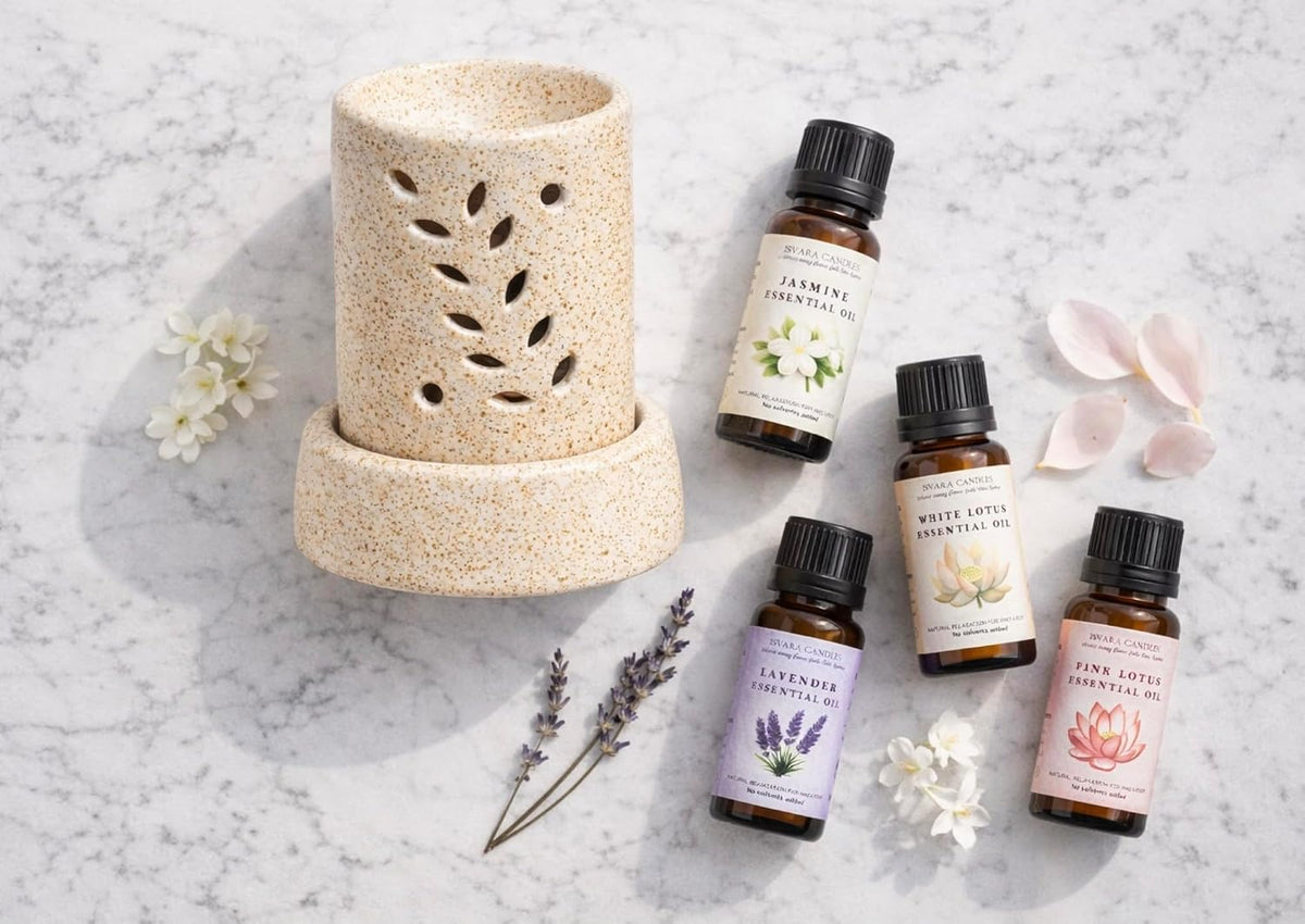ISVARA Ritual Set diffuser and four fragrance oils arranged on marble